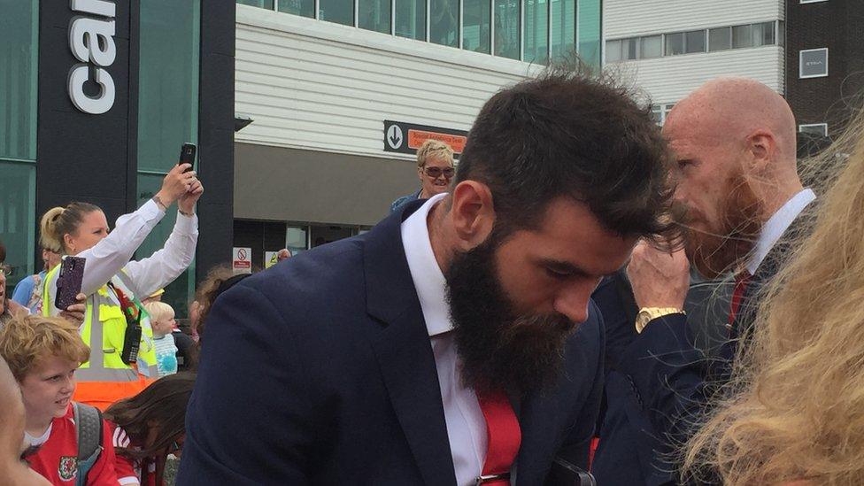 Joe Ledley and James Collins are mobbed by fans