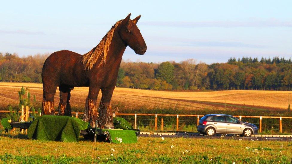 Horse sculpture on roundabout