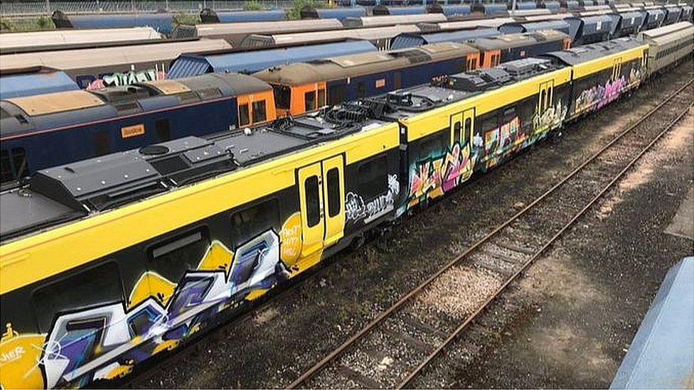 Merseyrail train covered in graffiti