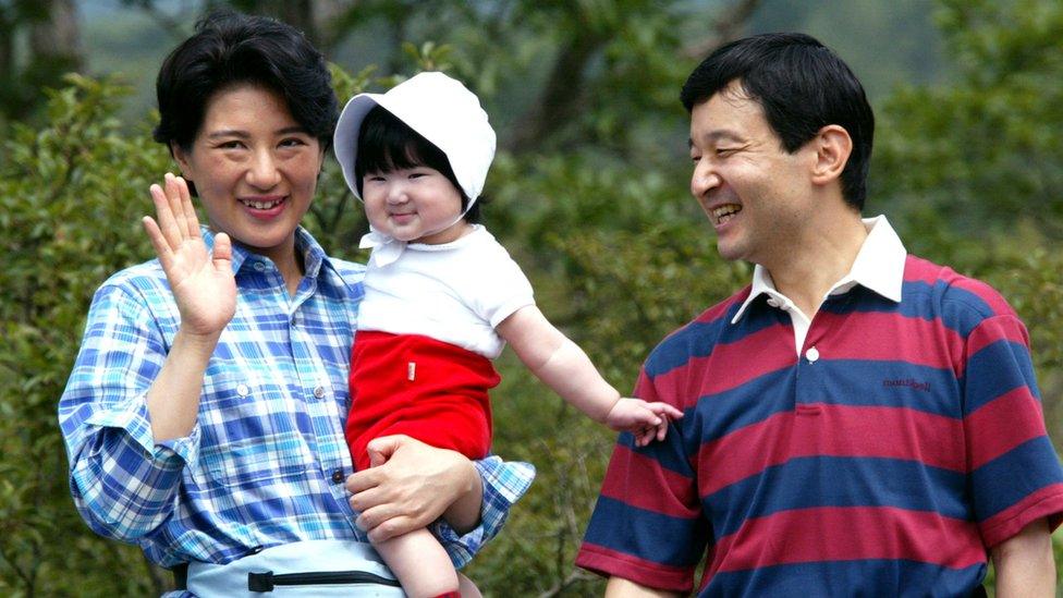 Crown Princess Masako and Crown Prince Naruhito along with daughter Aiko take a walk during a family outing 16 August 2002 in Tochigi Prefecture, Japan