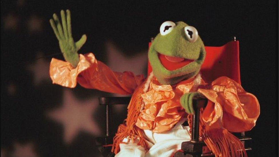 Kermit the frog on a chair