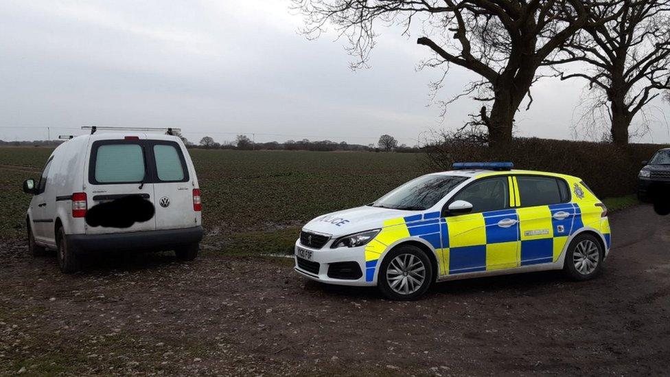 Police seizing a VW Caddy van