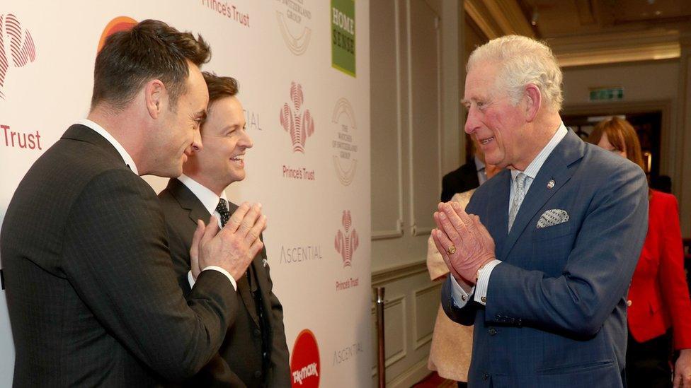 Prince Charles, Prince of Wales uses the Namaste gesture to greet television presenters Ant McPartlin (L) and Declan Donnelly as he attends the Prince"s Trust Awards