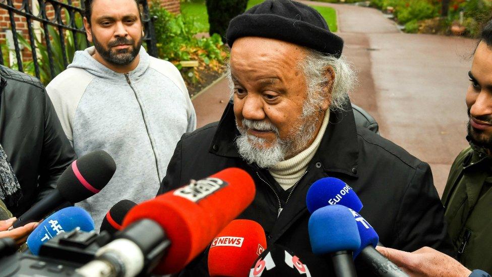 Founder of the Zahra Centre France, Yahia Gouasmi, speaks to journalists outside the centre near Dunkirk on October 2, 2018