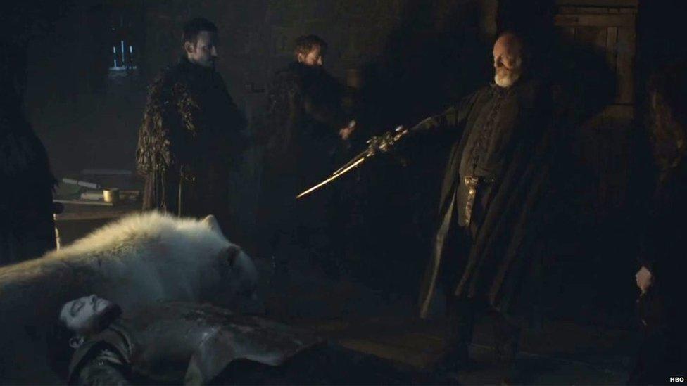 Davos with Jon Snow's sword in the Game of Thrones series six trailer.