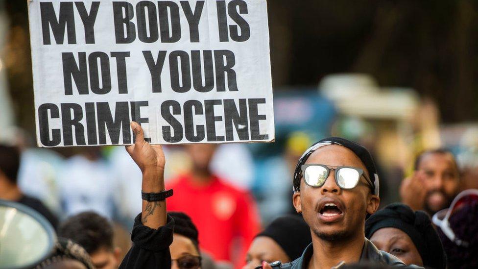 Protesters at an anti-gender violence rally