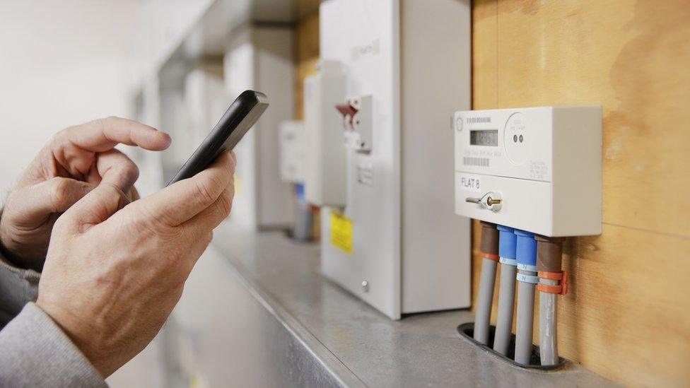 Person taking electricity meter reading on their smart phone