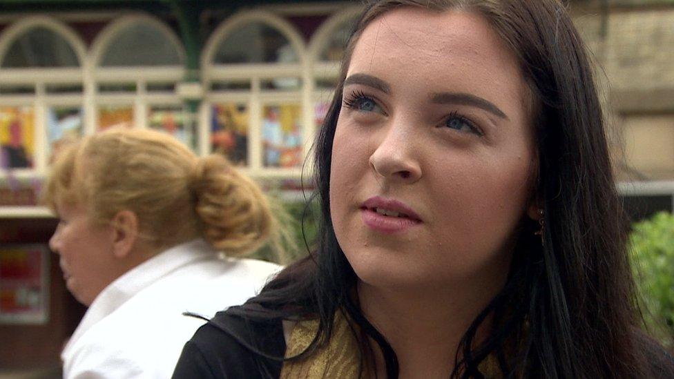 Young shopper outside Binns House of Fraser Darlington