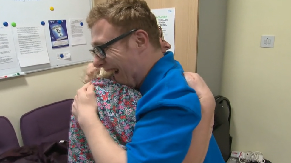 Harrison hugging his mum Jo Holmes