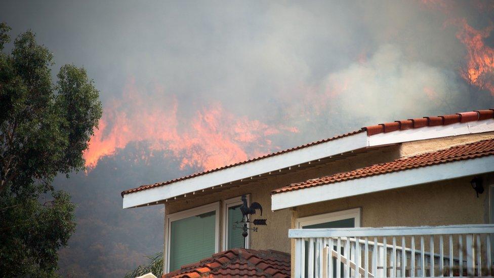 The Holy fire burns near homes in Lake Elsinore, California, south-east of Los Angeles, on August 10, 2018