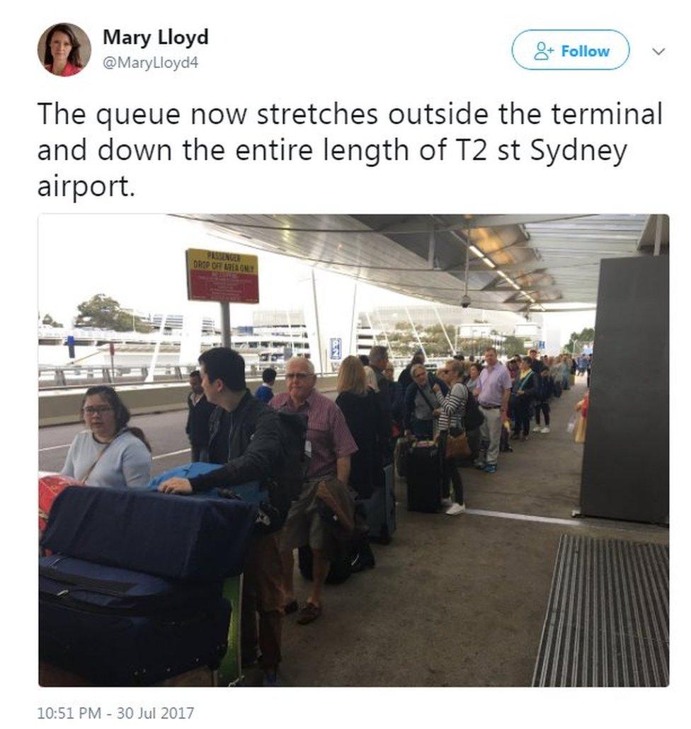 The queue now stretches outside the terminal and down the entire length of T2 st Sydney airport.