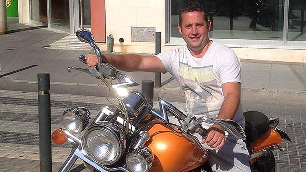 Charlie Birch sitting on a motorcycle