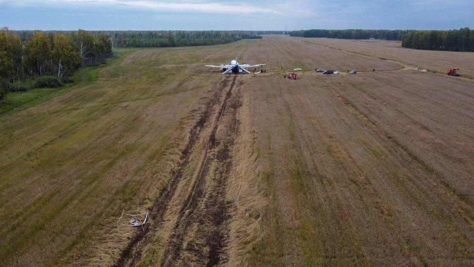 Ural Airlines plane cuts trenches into the field from its landing