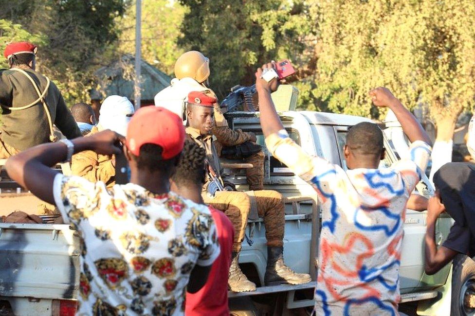 People show their support for the military after they deposed President Kabore in Ouagadougou, Burkina Faso, on 24 January 2022