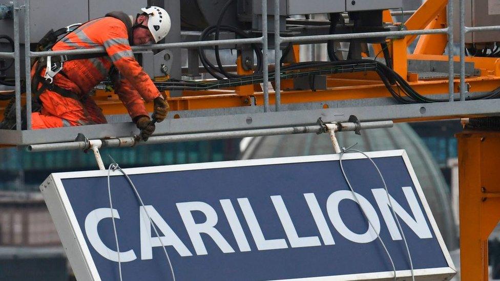 Carillion sign being taken down