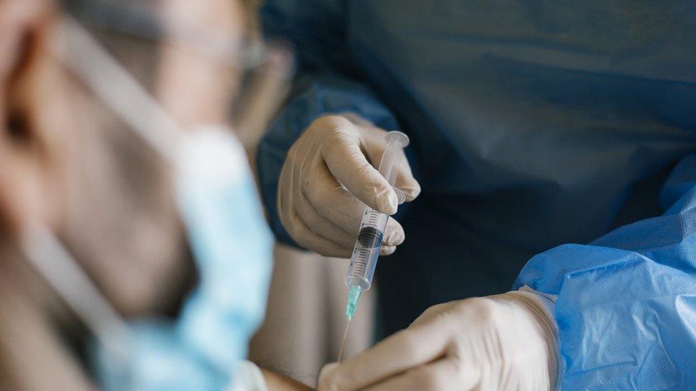 Vaccines being given in care home