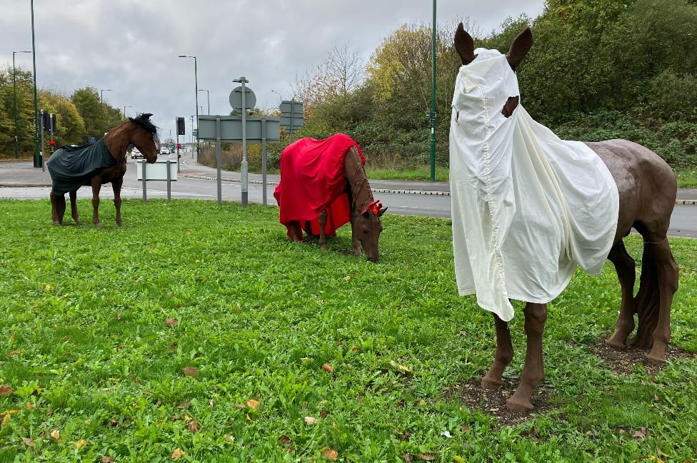 Horse sculptures in Sneinton dressed for Halloween