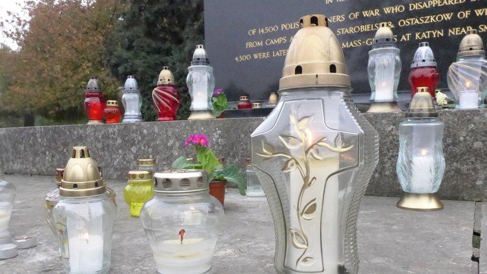 Candles on grave at Gunnersbury Cemetery