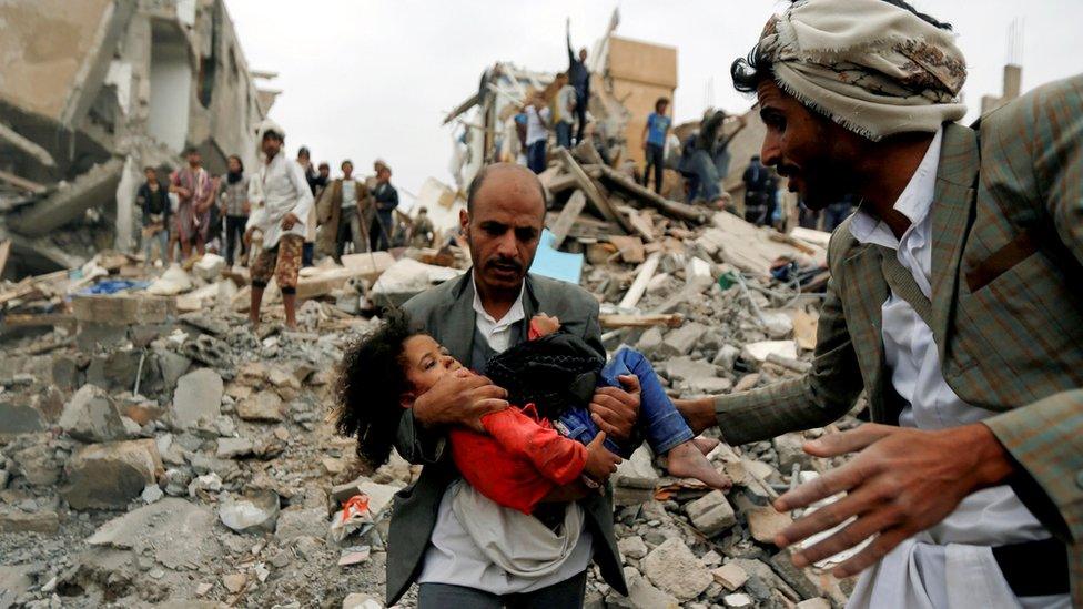 Buthaina Muhammad Mansour being rescued from the site of a Saudi-led air strike on Sanaa which killed eight of her family members.