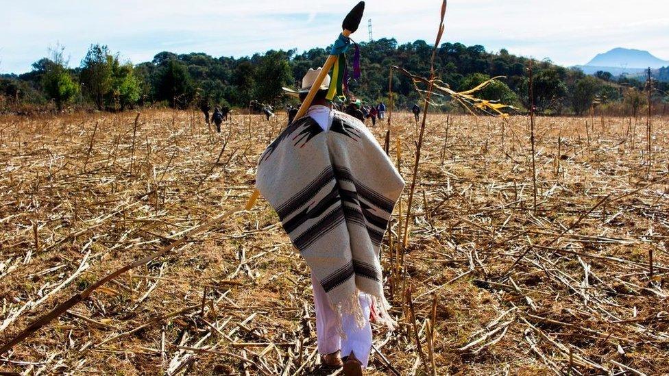 A Purepecha indigenous man walks during the beginning of the celebration of the Purepecha New Year in Chilchota, Michoacan state, Mexico