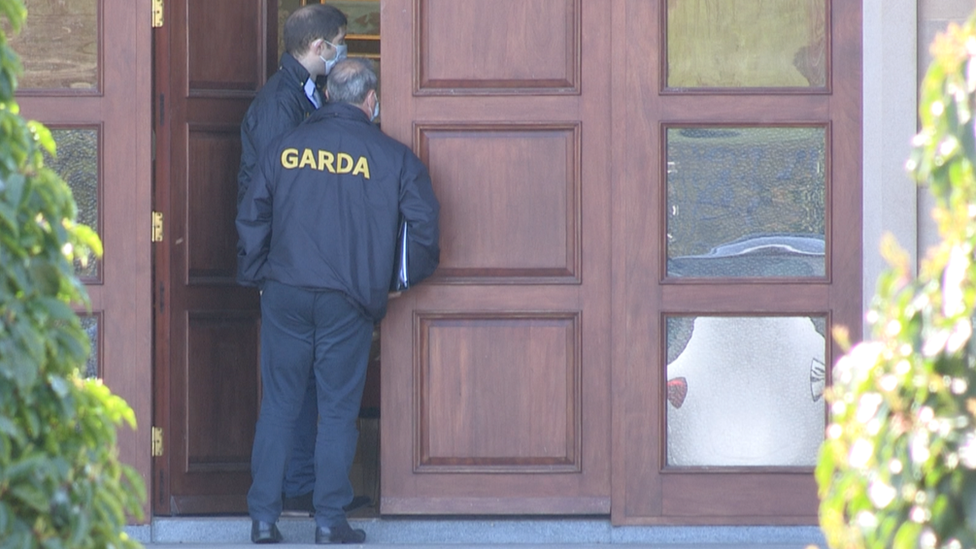 Irish police at home of Sean Quinn on Wednesday