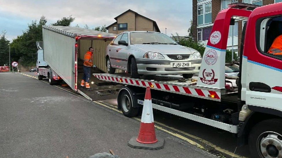 Picture of Mark Barrott's car being removed on Tuesday