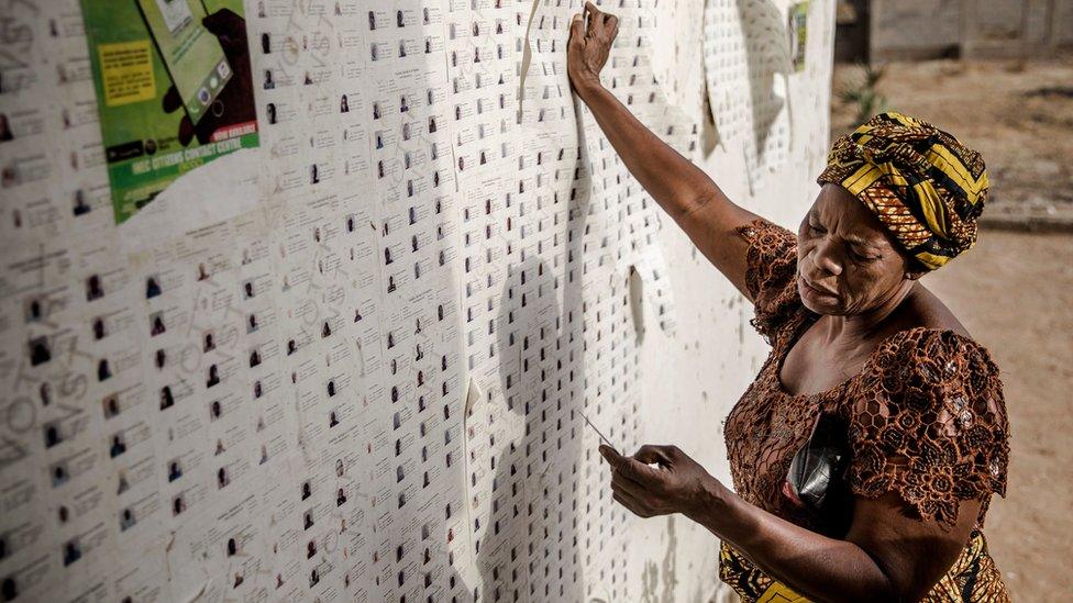 Woman checking her name on the list