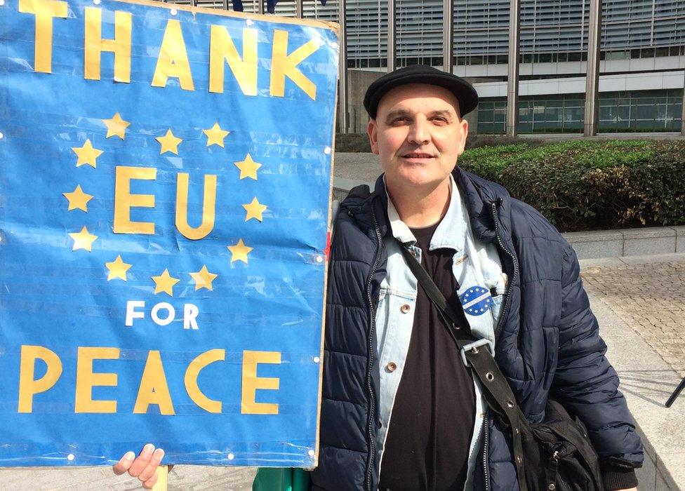 Demonstrators holds a banner which reads "Thank EU for peace"