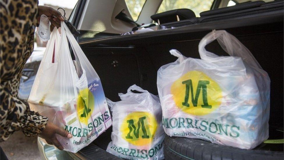 customers with Morrison shopping bags