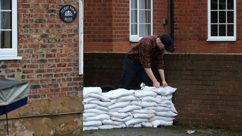 man-with-sandbags.