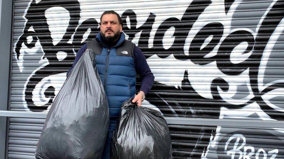 Imran Hameed, founder of the volunteer group Bearded Broz in Smethwick, Birmingham, with some donations