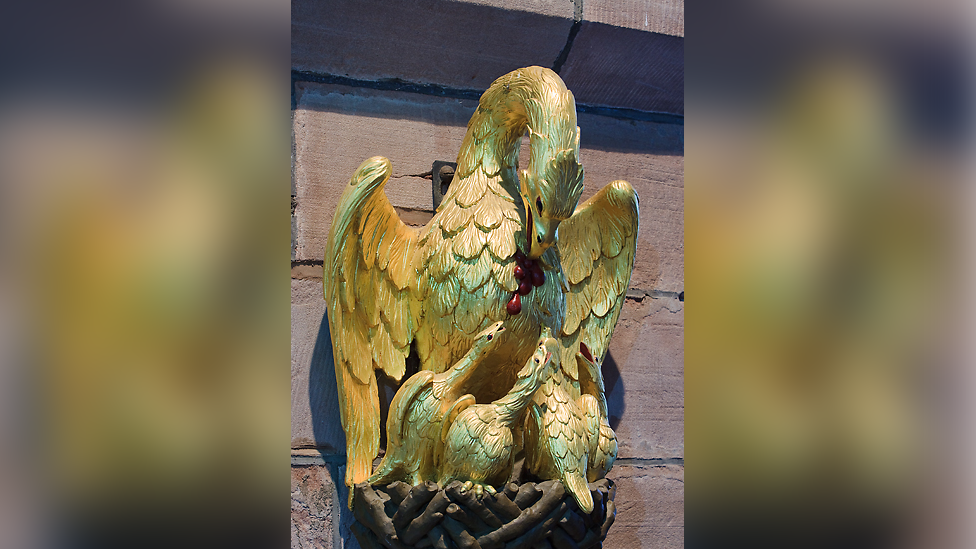 Golden pelican statue