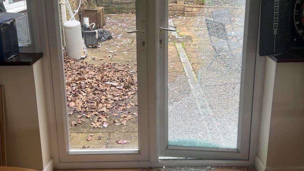 Smashed conservatory door at Preeti Nayyar's home