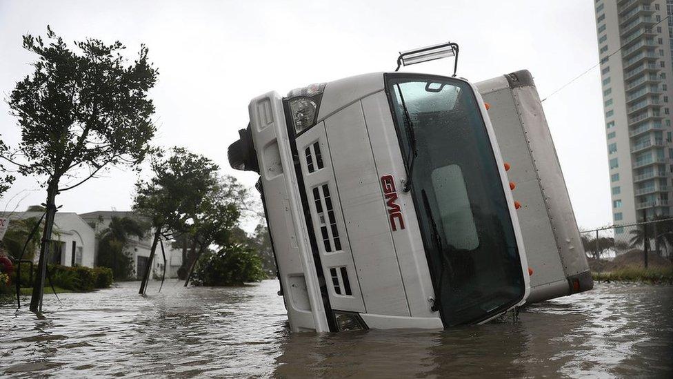 A truck is seen on its side after being blown over as Hurricane Irma passed through on September 10, 2017 in Miami, Florida.