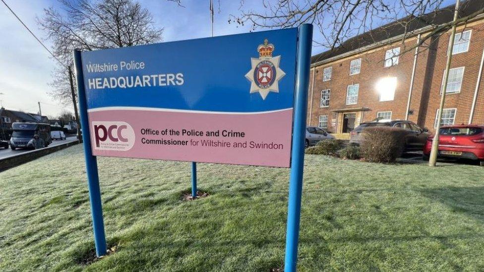 The Wiltshire Police sign in front of their headquarters made from red brick in Devizes