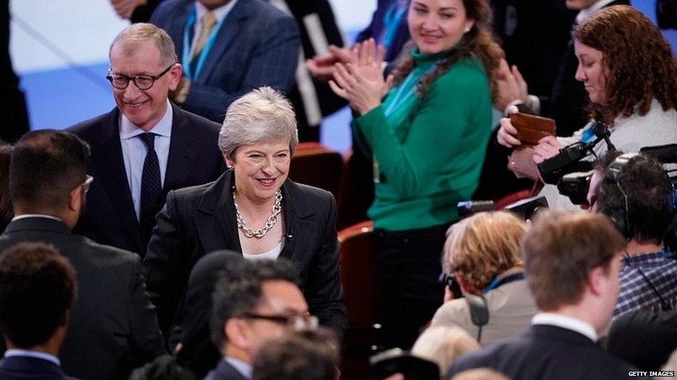 Theresa May leaves the stage at the end of her conference speech