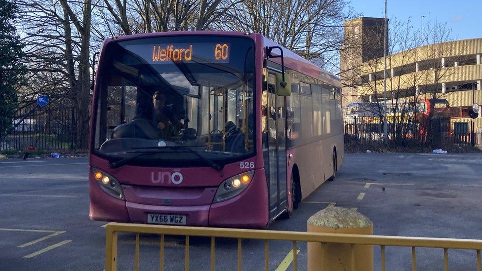 A route 60 bus displaying Welford on the front parked at a bus station