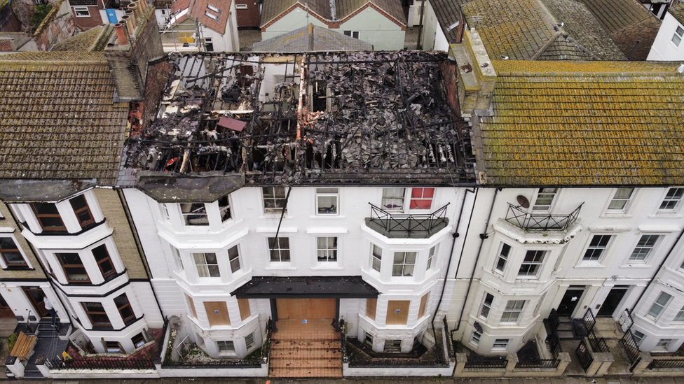 Drone shot shows the extent of damage to the roof of the building