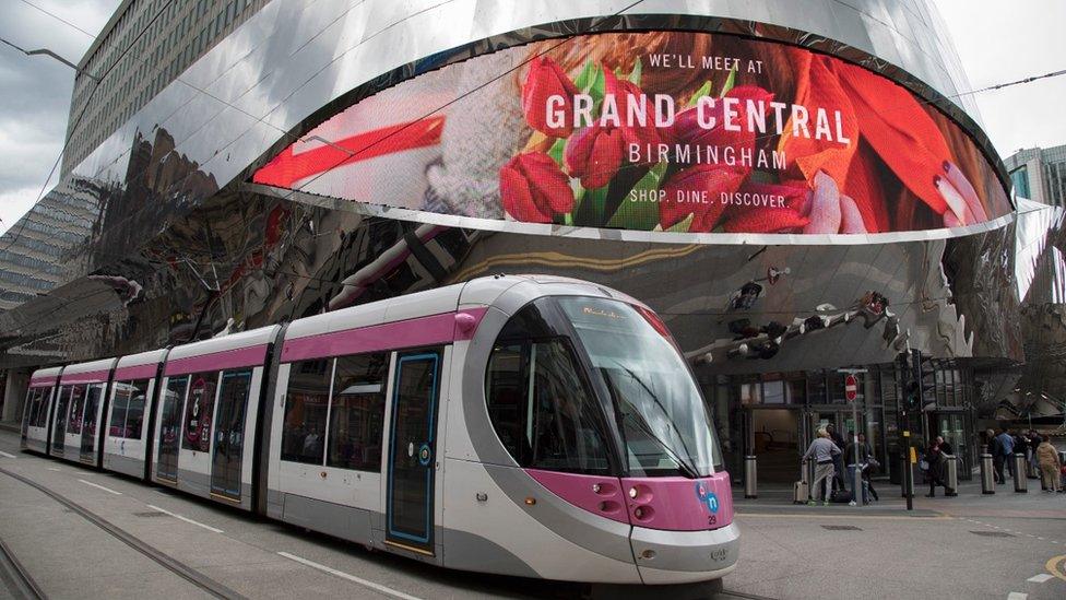 Grand Central shopping centre with a passing Midland Metro light-rail tram in Birmingham