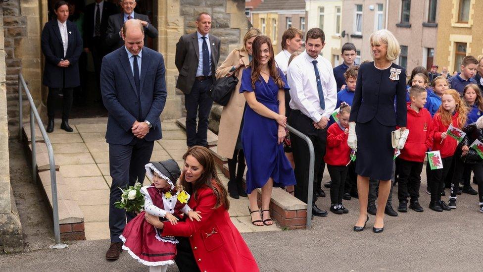 Catherine, Princess of Wales, embraces Charlotte, two, during a visit to St Thomas Church in Swansea