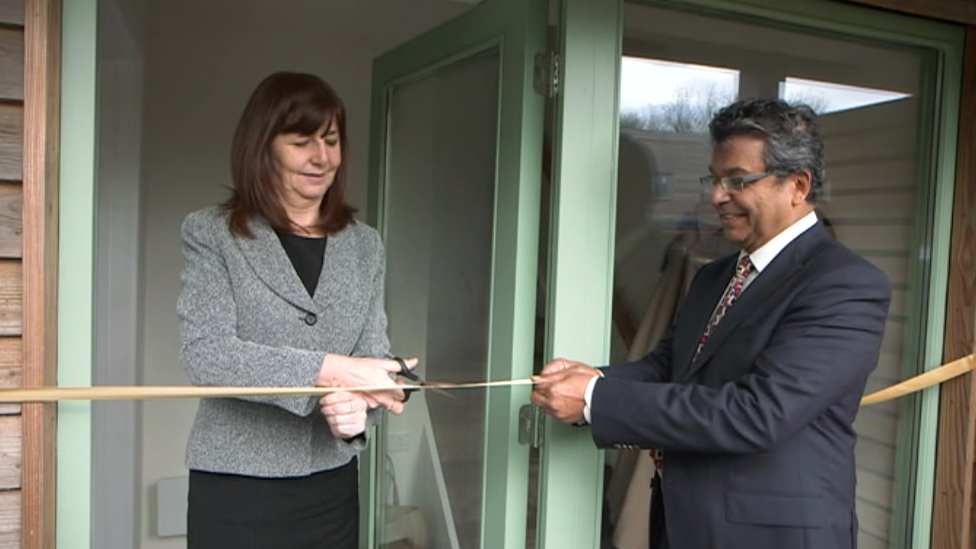 Environment Secretary Lesley Griffiths cuts the ribbon to Pentre Solar with Western Solar chief executive Dr Glen Peters