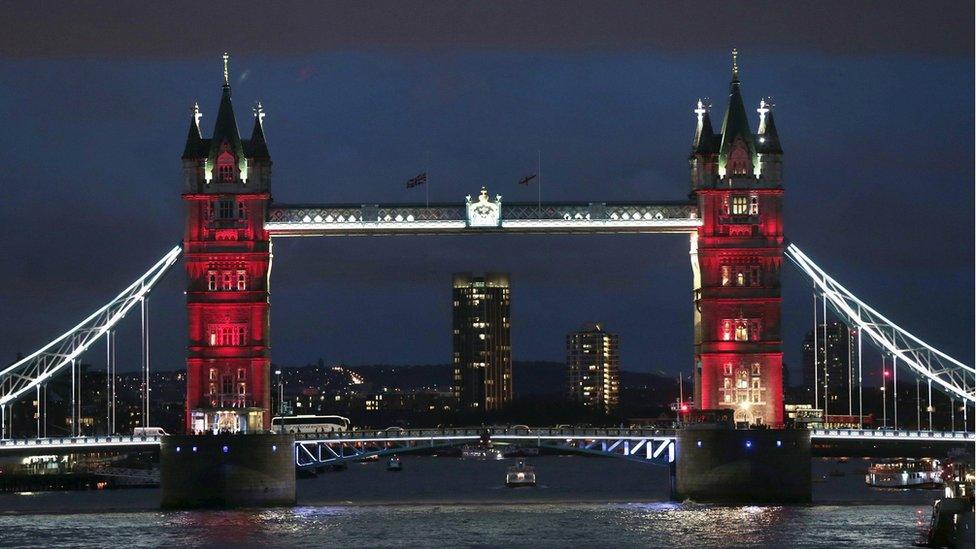 Tower Bridge in London lit up in the colours of the French flag