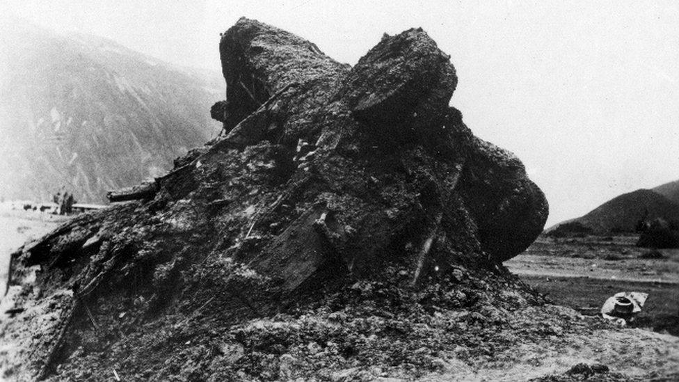 View of a bus and a lorry covered by debris during the earthquake on 31 May 1970