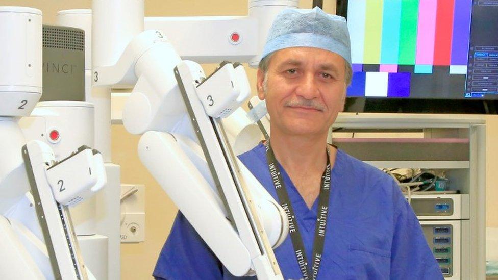 Consultant Mehmood Akhtar pictured with the new surgical robot