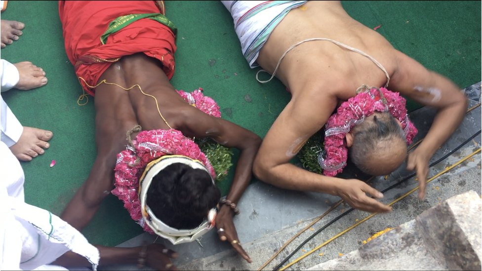 Mr Rangaran and Aditya praying together inside the temple.