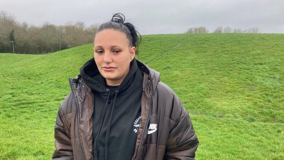 Jordan Turner standing at the foot of the Venny a grass mound, in Pinehurst Swindon, where her brother, Lee Turner, lost his life