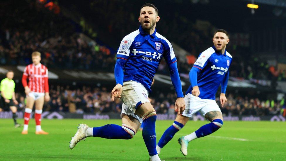 Chaplin celebrates alongside teammate Wes Burns at Portman Road