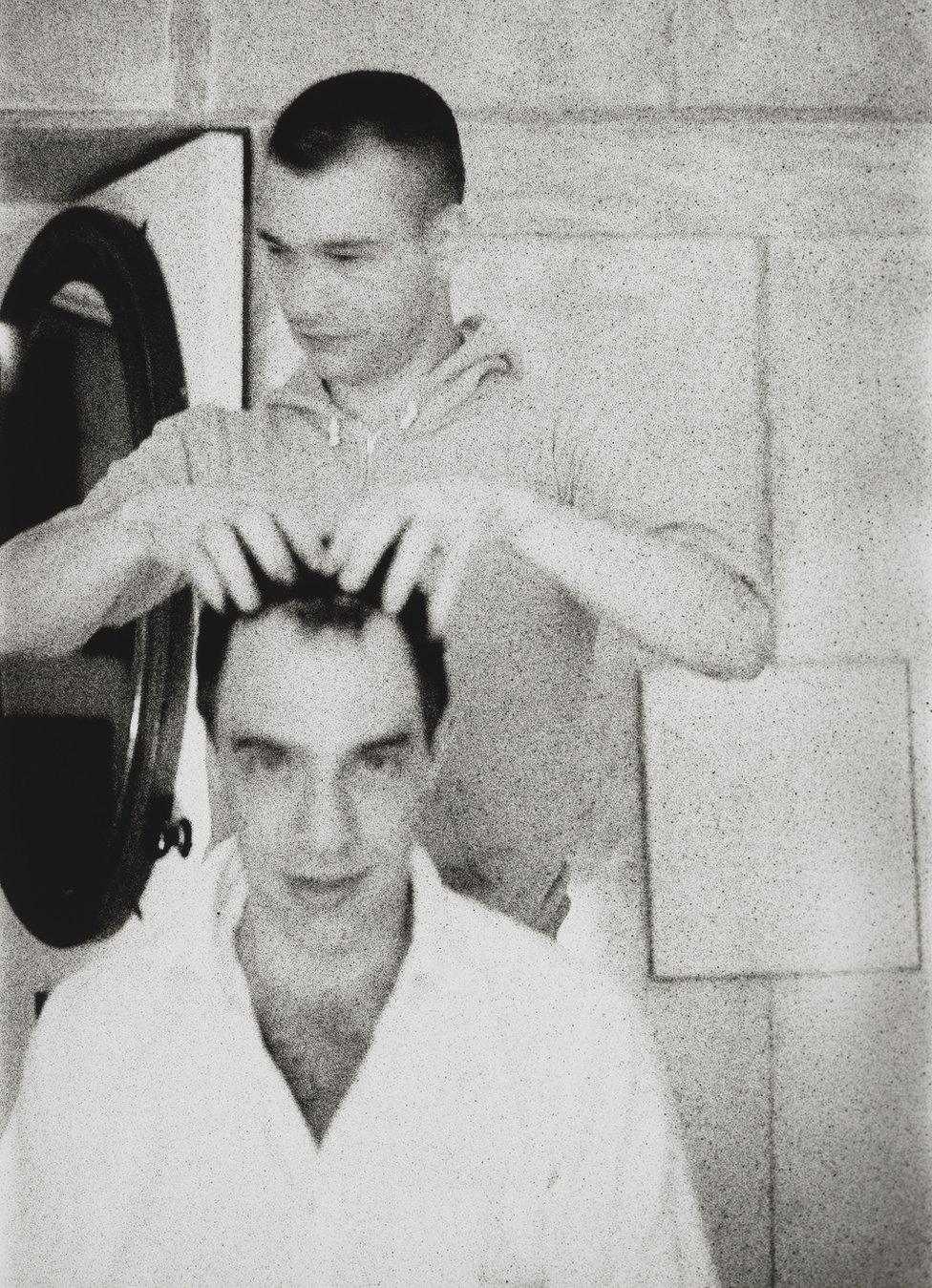 Derek Jarman and John Maybury stand next to each other, c.1982–83