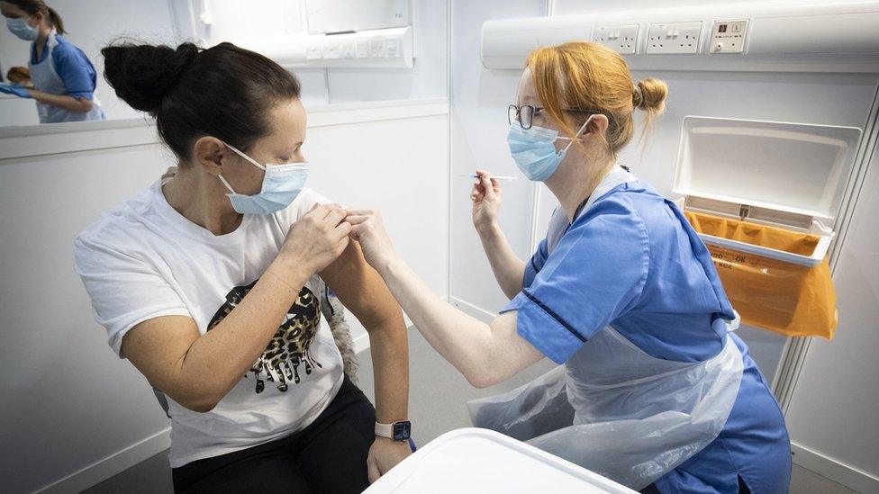 A person being vaccinated