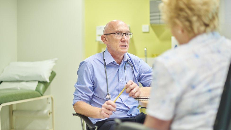 Doctor in consultation with patient